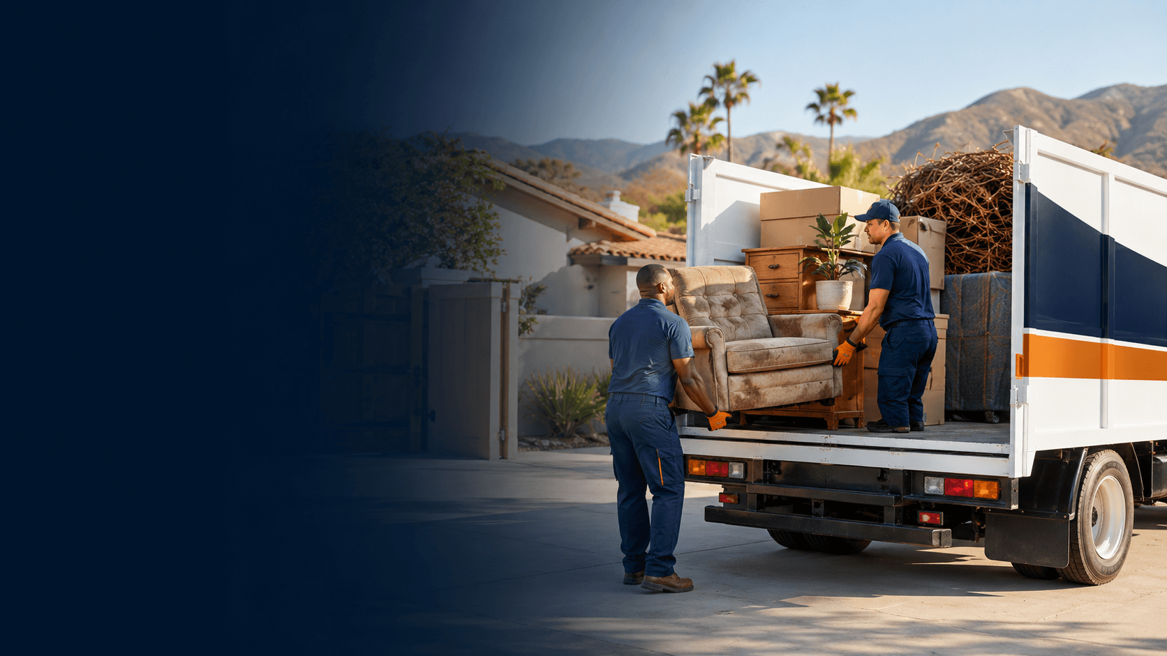 Professional removal crew loading organized household items for hauling.